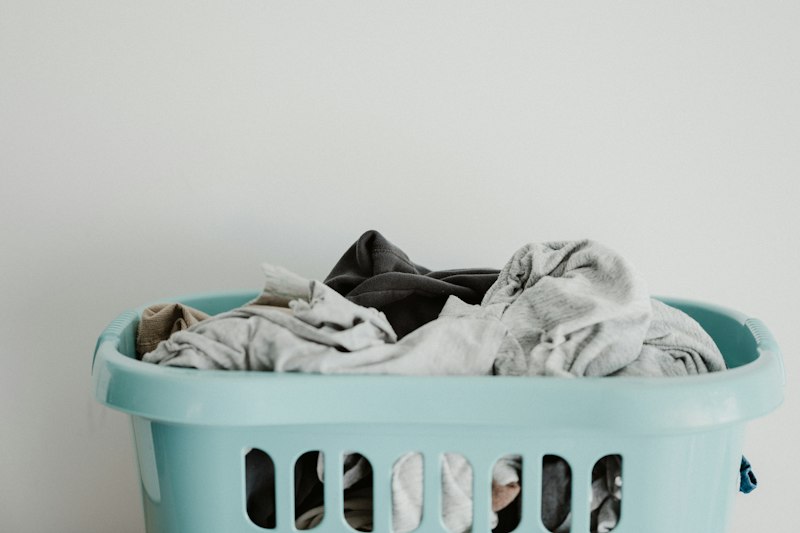 Pristine folded organic waffle towels and fresh linens in a natural basket
