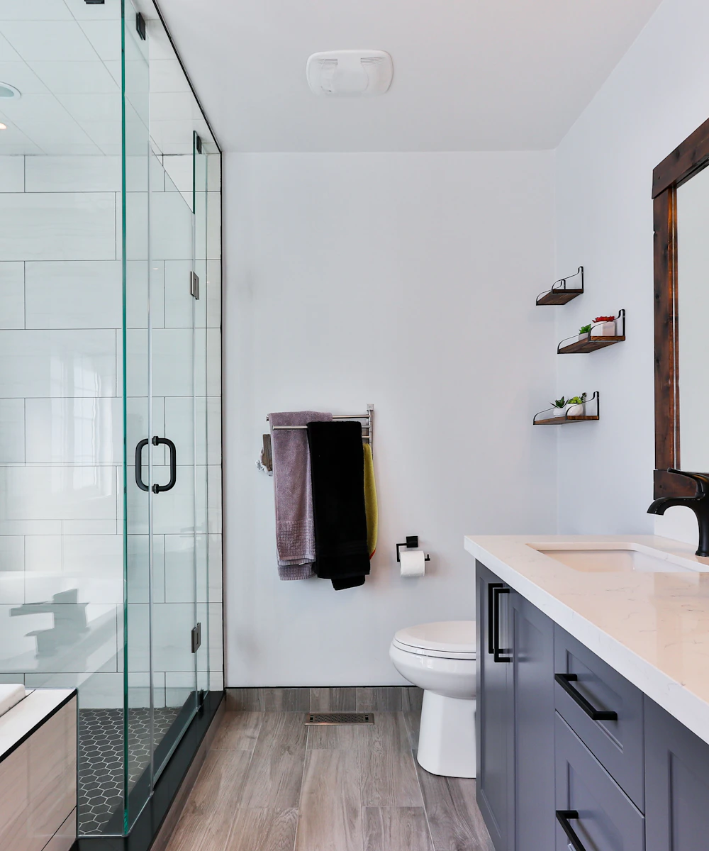 Carefully curated organic home care essentials, natural brushes, and fresh rolled linens on marble